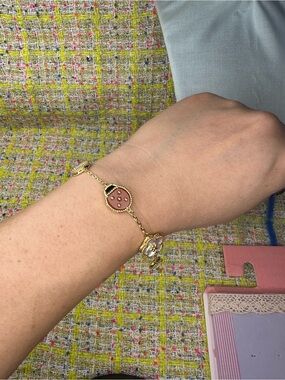 A great Gold-Link Bracelet with Pink and White Enamel Charms